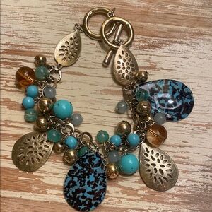 Gold and Blue Charm Bracelet with Textured Charms